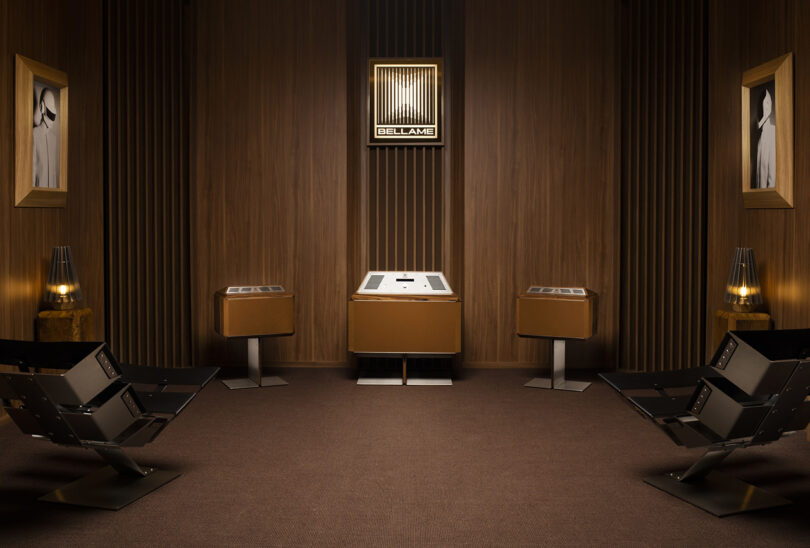 Bellame three speaker system finished in wood cabinetry set in wood paneled room.