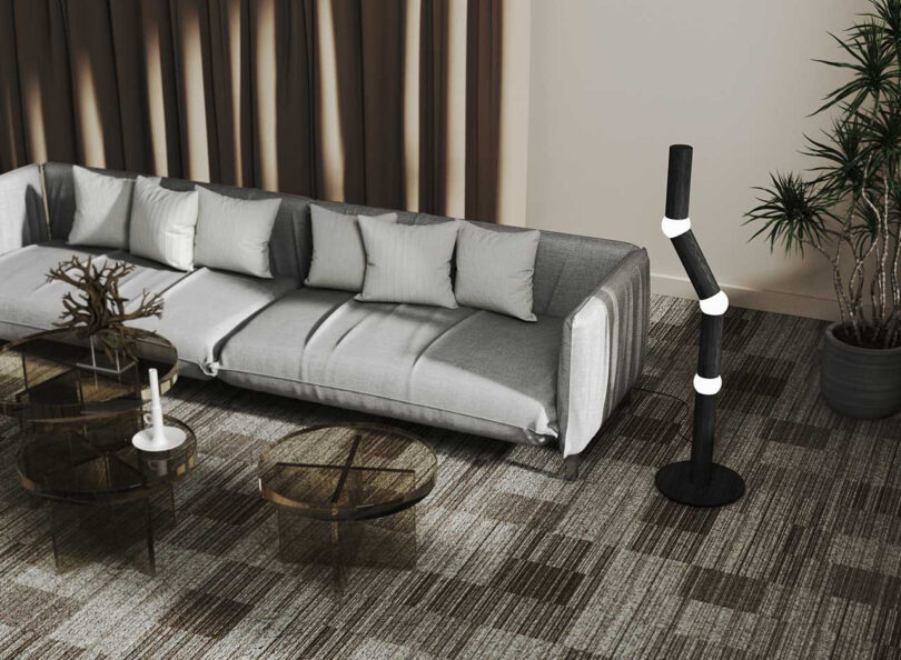 styled interior with grey sofa and modern floor lamp