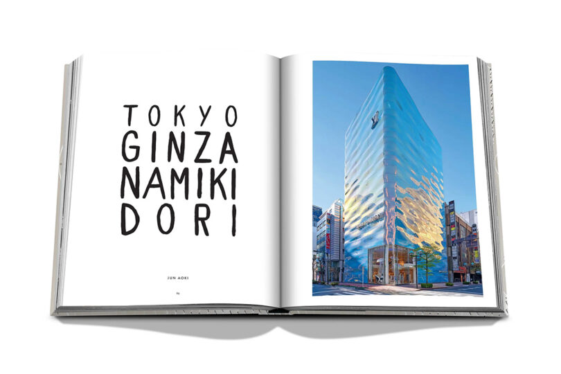 Open spread of book with photo of the Louis Vuitton store in Ginza district of Tokyo.