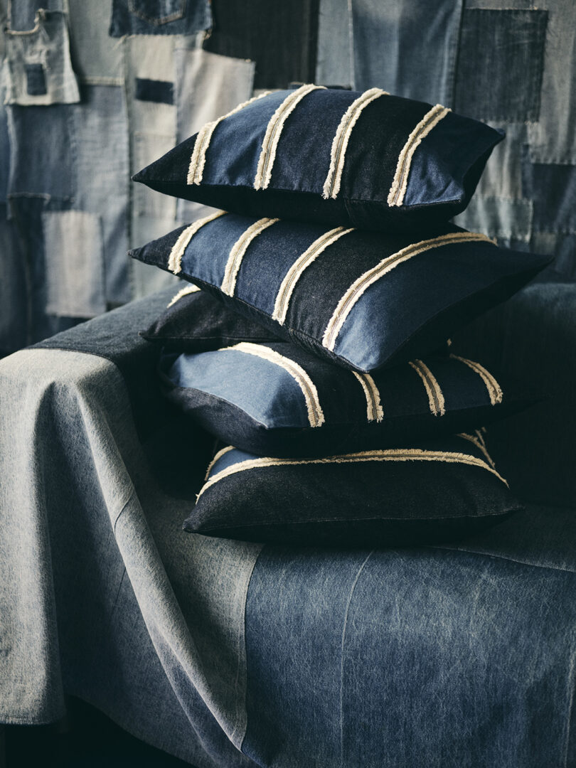 stack of striped denim throw pillows