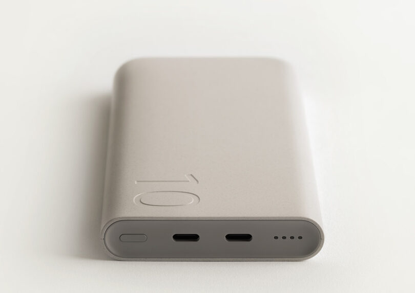 Neutral hued Samsung x Layer Battery Pack shown laid down with charging ports visible.