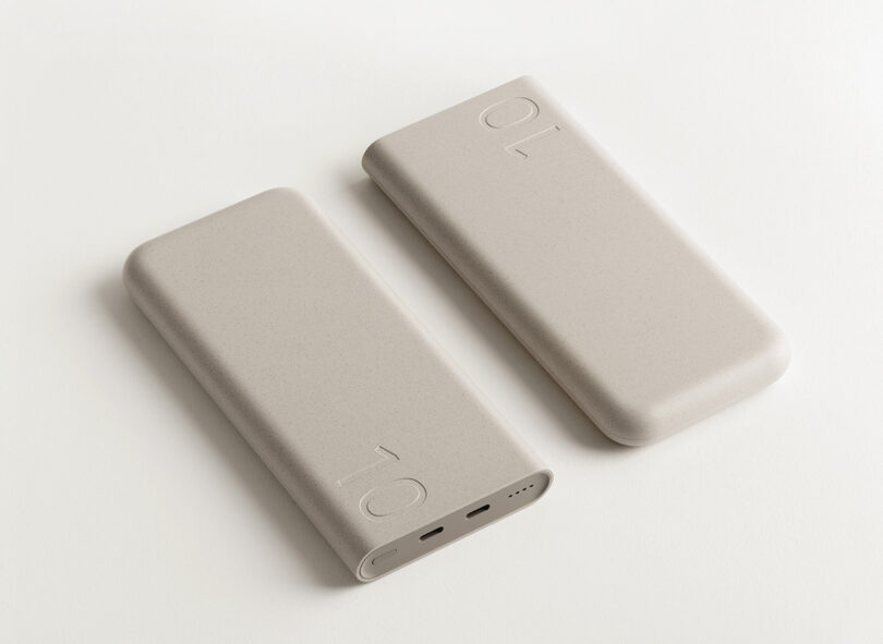 Two neutral hued Samsung x Layer Battery Packs shown laid down side by side.