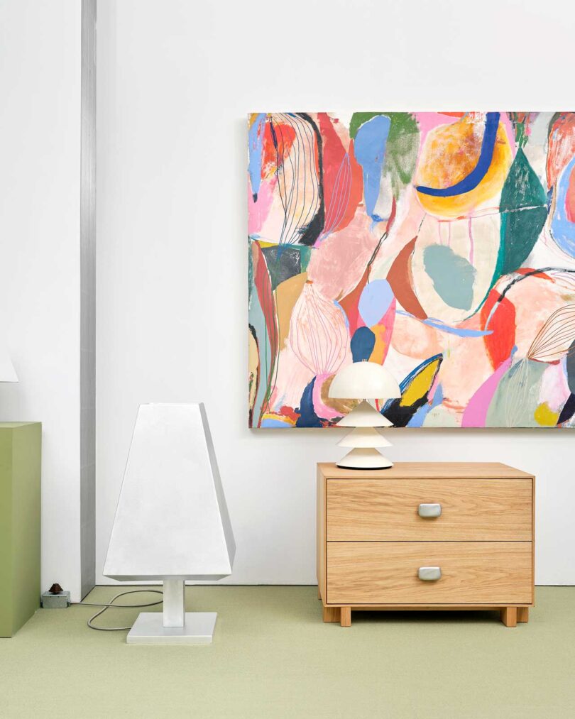 exhibition vignette with colorful abstract art and modern furniture