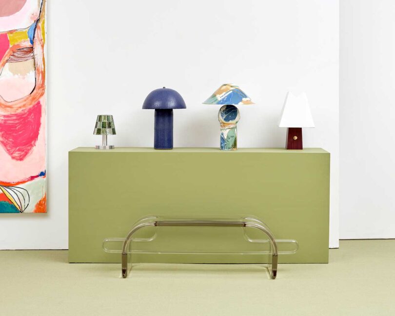 exhibition vignette with colorful abstract art and modern furniture