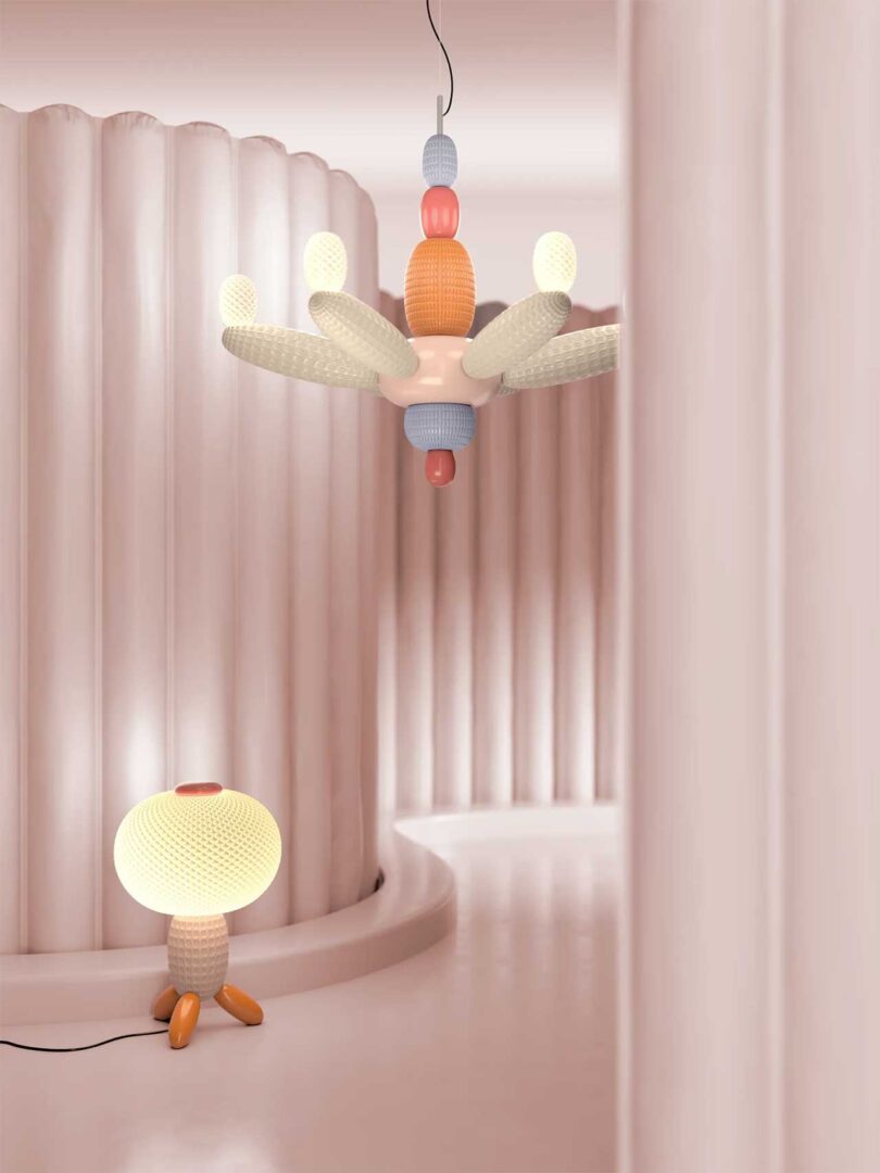 a colorful balloon like lighting pendant and table lamp in space curved pink fluted walls