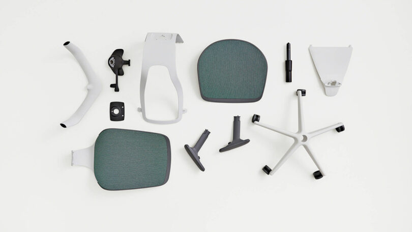 Disassembled Steelcase Karman task chair components laid out on floor.