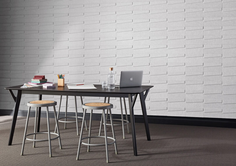 white acoustic wall tiles in a styled space