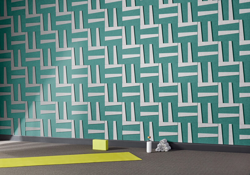 turquoise and white acoustic wall tiles in a styled space