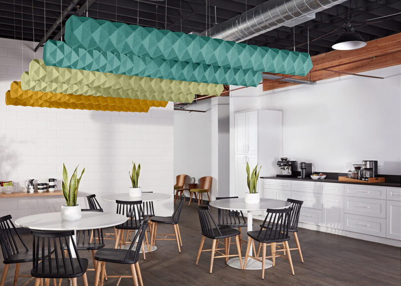 ombre acoustic baffles hanging in a styled space