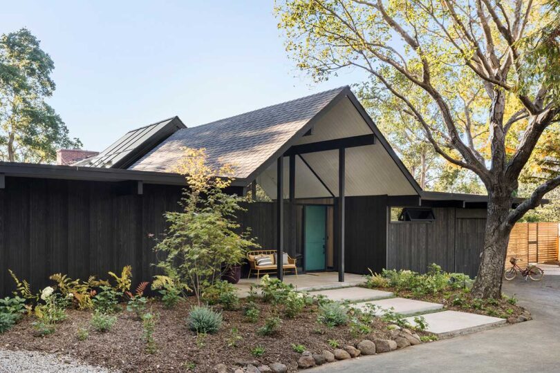 angled cropped front view of modern black house with pitched roof