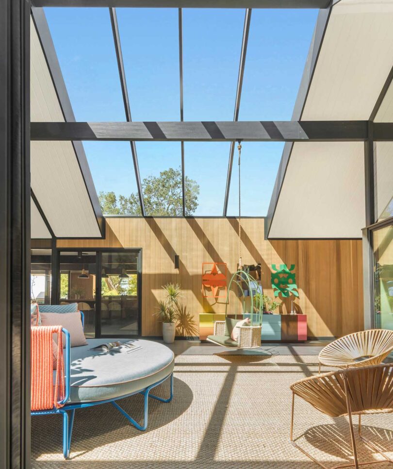 interior view of mid-century modern living space with skylights above