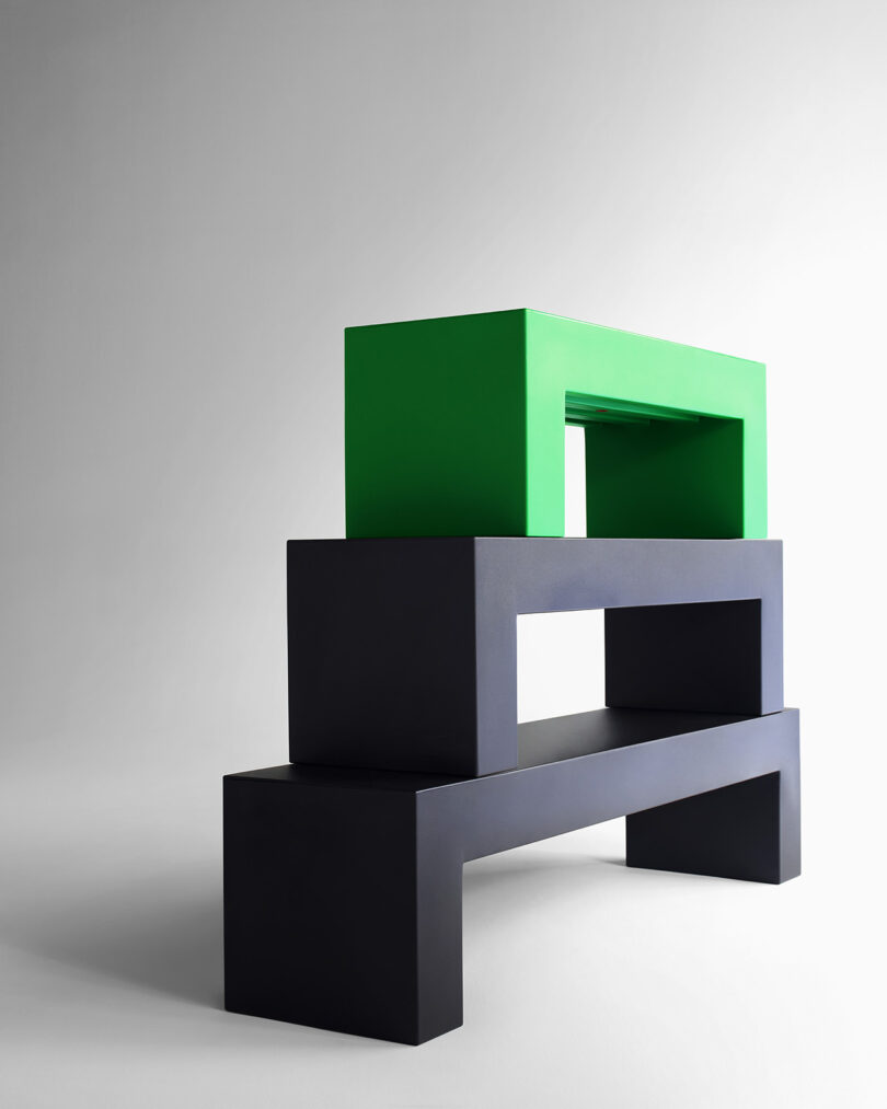 three stacked minimal modern black and green outdoor benches