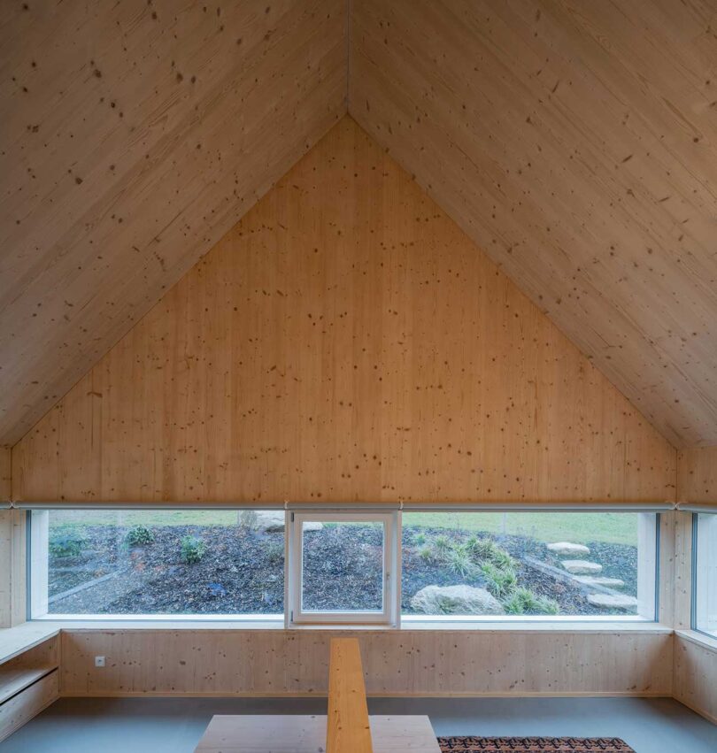 interior shot of room with pitched wood roof ceiling 