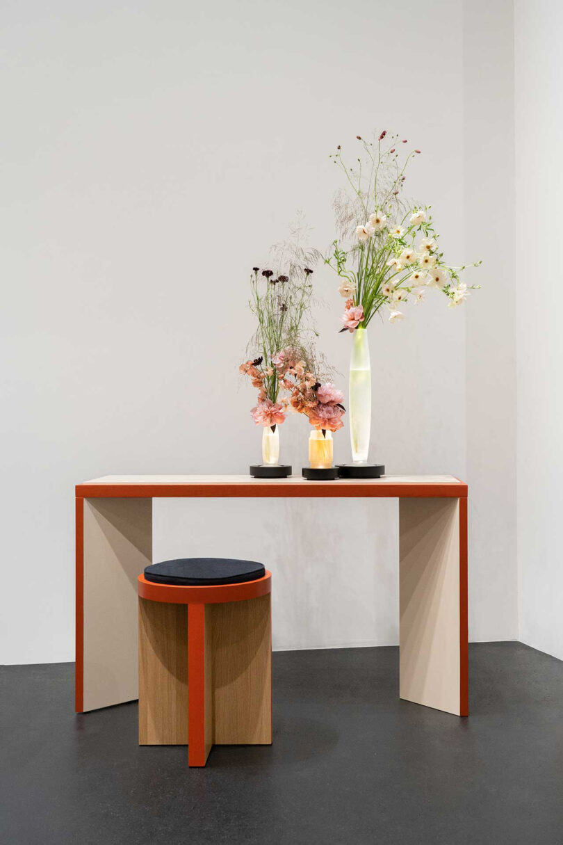 console and tables/stools with orange detailing