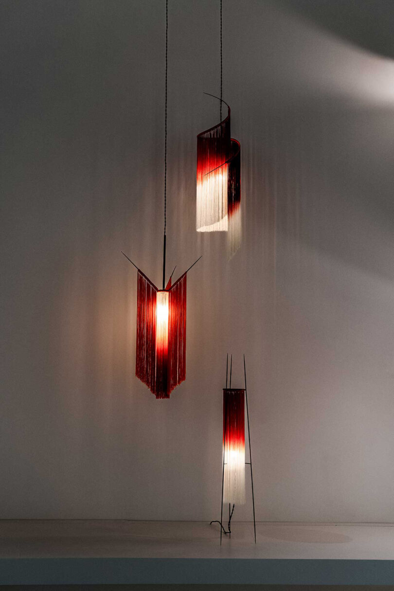 three hanging red and white light pendants