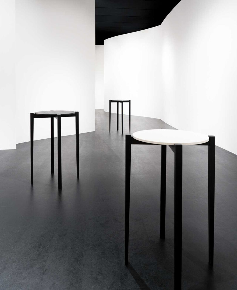 three modern black and white occasional tables