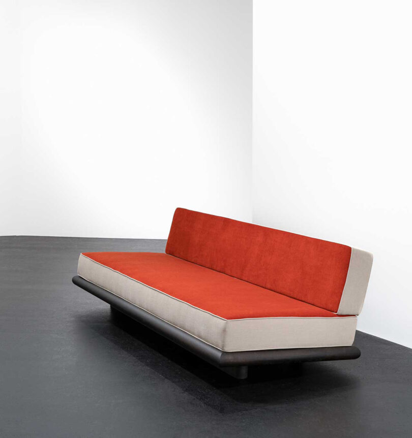 orange and light grey armless sofa