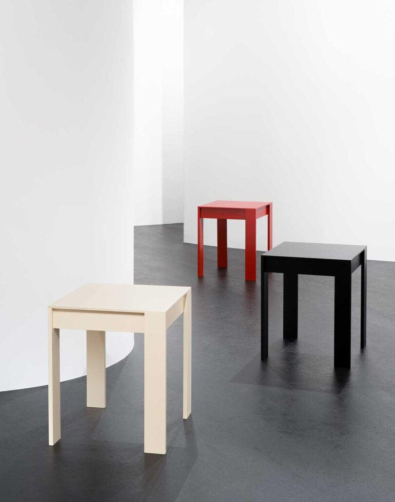 three red, white, and black occasional tables