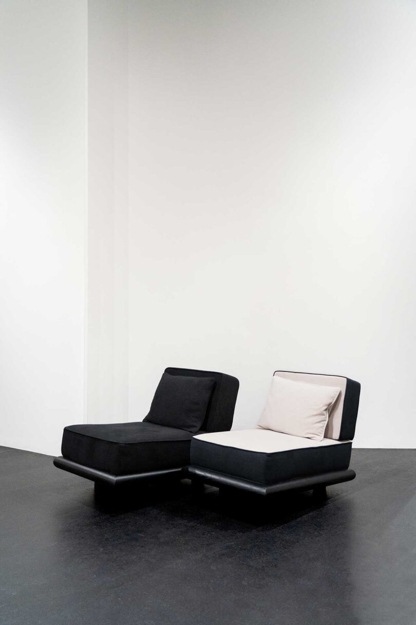 one black and one white and black lounge chair
