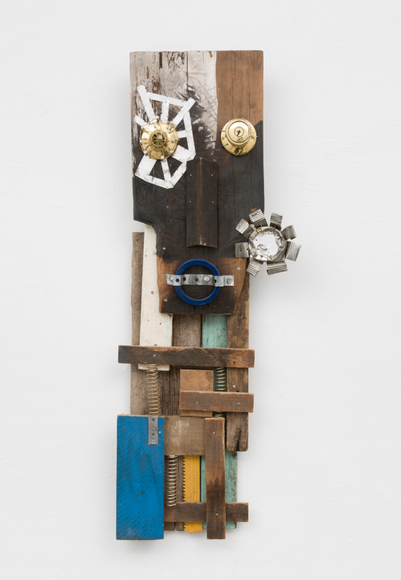 abstract sculpture made of wood, wax, metal, nails, and found objects