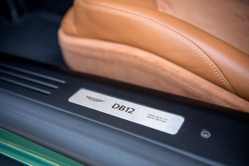 Driver side doorsill badge inside the Aston Martin DB12.