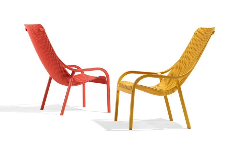 two red and yellow outdoor lounge chairs on white background