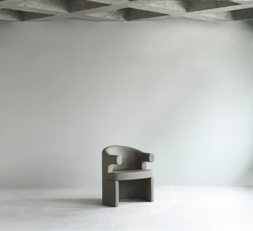 dark grey armchair in a studio space