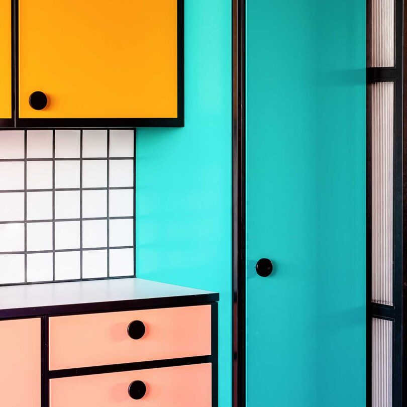 closeup angled view of brightly colored kitchen cabinets