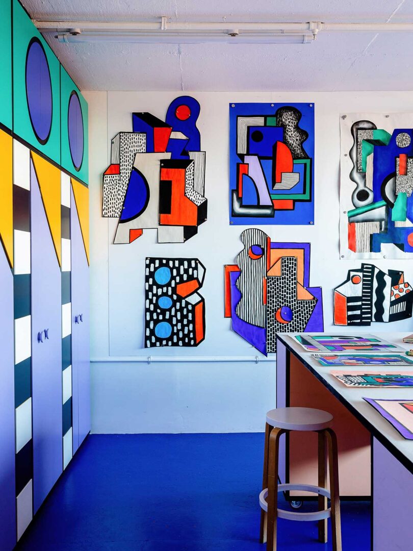 bright colorful office with geometric patterns and vibrant prints on wall