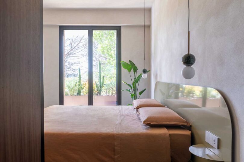 side view of modern bedroom with peach bedding