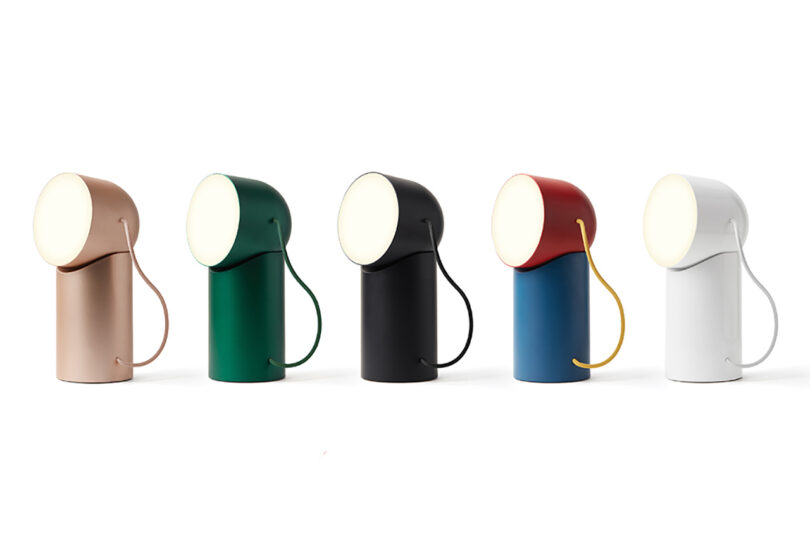 A line of all five Orbe colorways, from left to right: gold, green, black, red+blue, and glossy white.