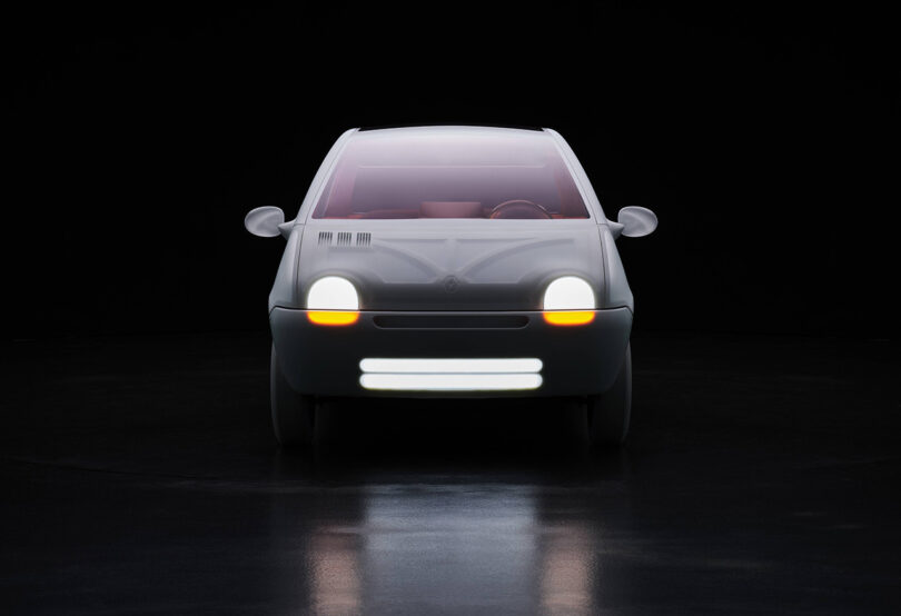 Front view of the 30th anniversary all-white exterior Renault Twingo, showing its twin light bar front.