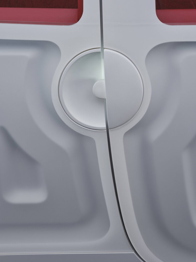 Detail of Renault Twingo's circular door handle with soft LED lighting spilling out from top half.