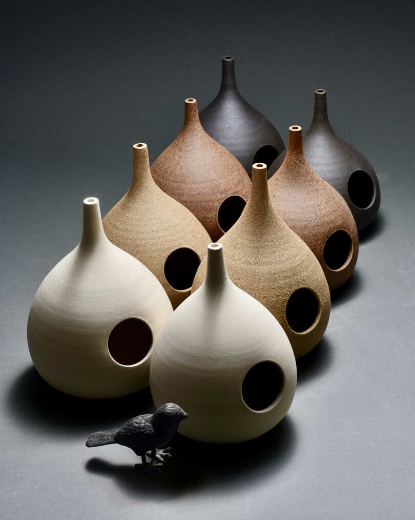 8 ceramic bulbous bird feeders in earth tones
