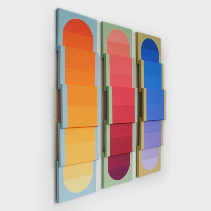 wall sculpture made of layered panels in gradient colors