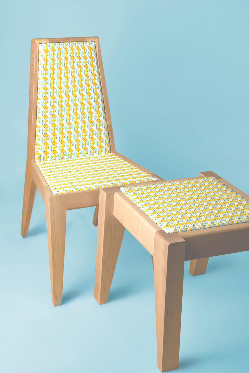modern chair and ottoman on light blue background