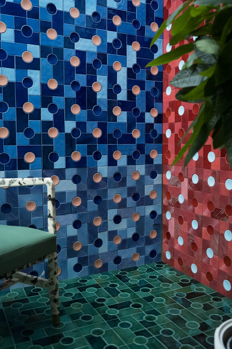 space with the walls covered in red and blue modern tiling