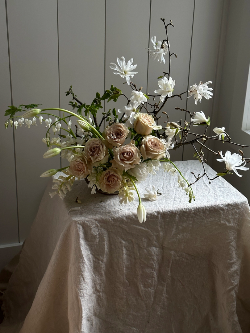 floral arrangement in hues of white and pink