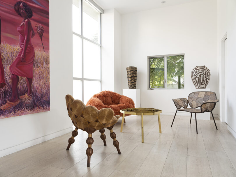 gallery space with large format art on the walls and equally creative chairs