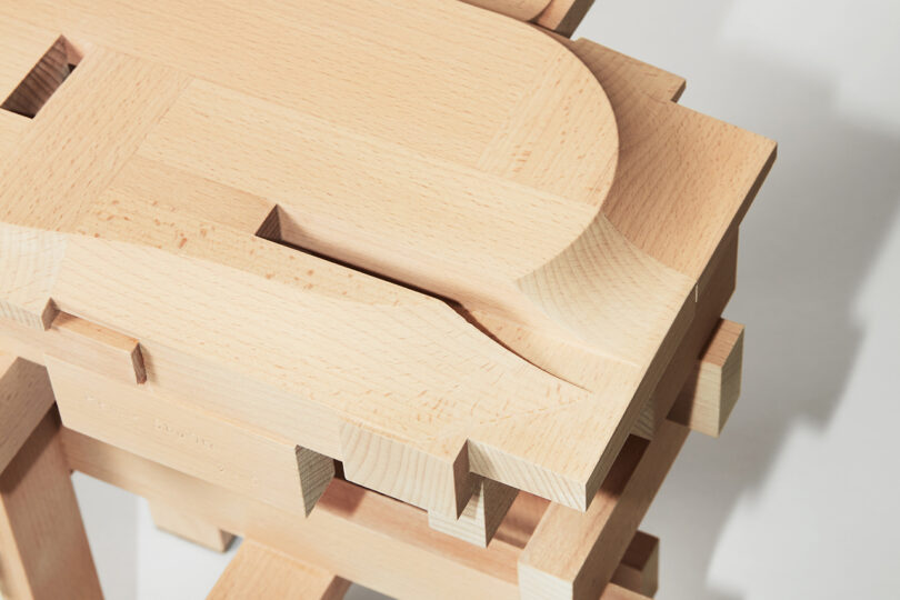 detail of wood stool made of squared off pieces of wood