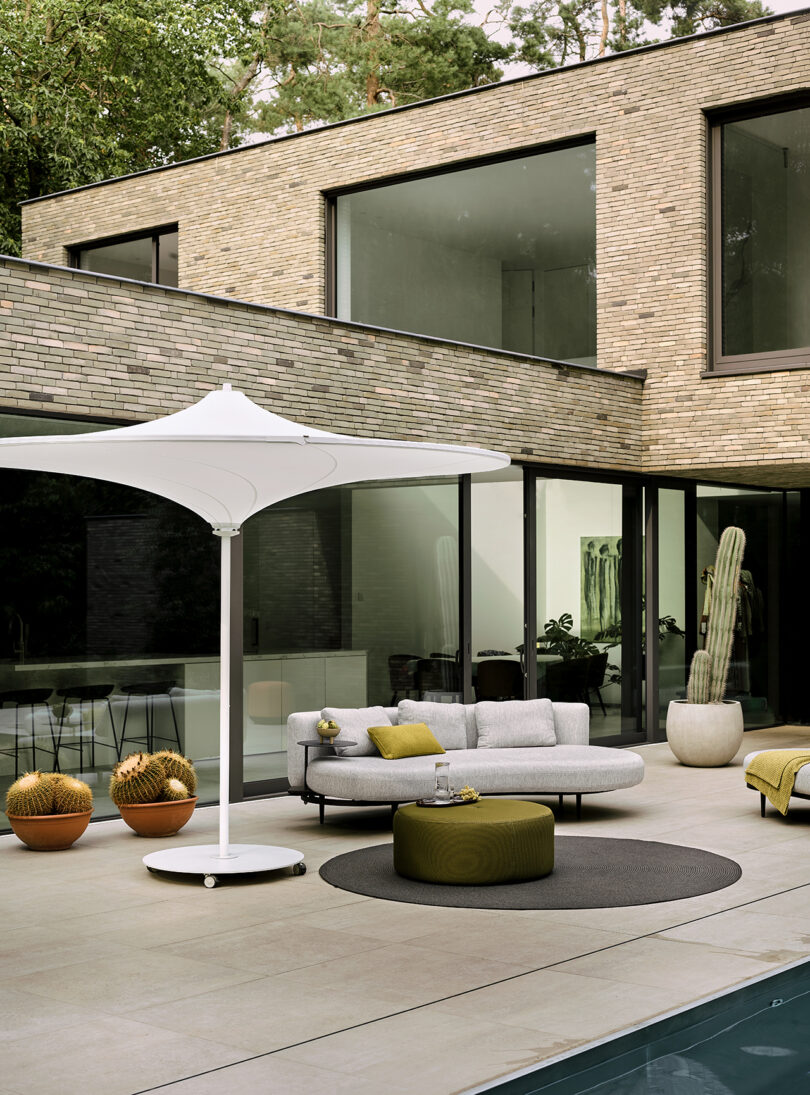 styled outdoor patio with furniture and umbrella