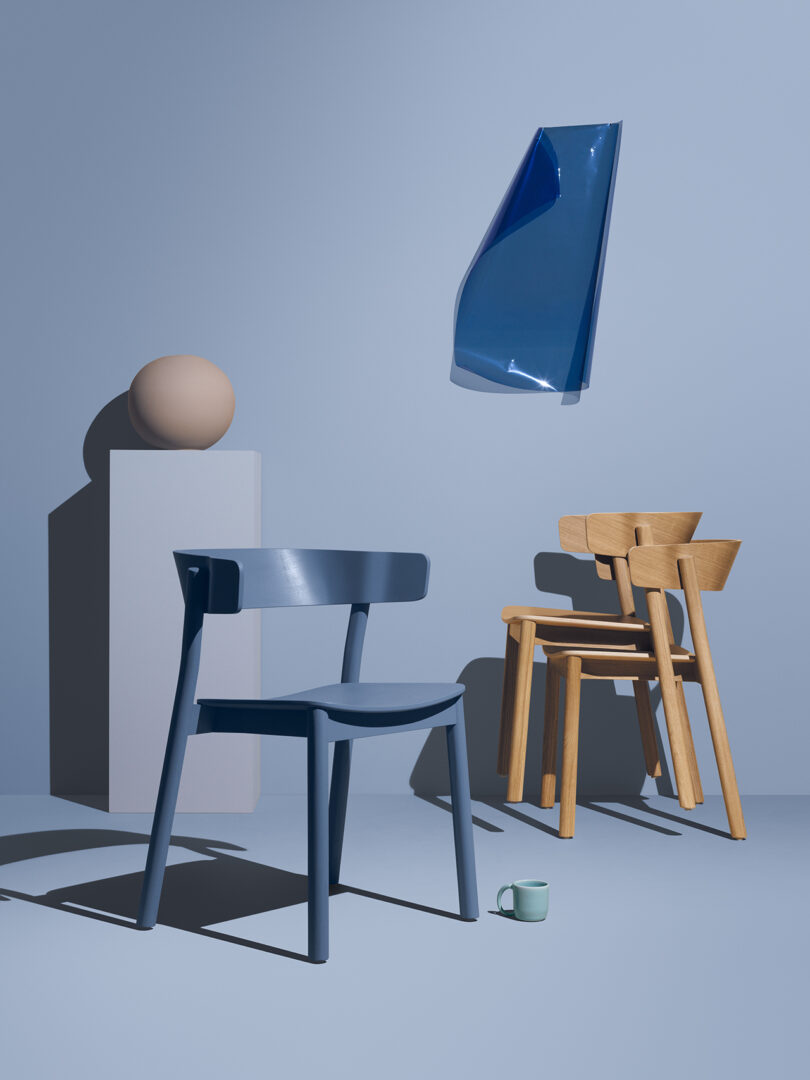 monochromatic styled blue space with three chairs