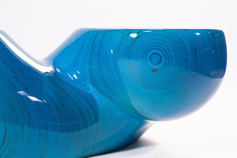 detail of glossy cyan blue twisted stacked plywood table