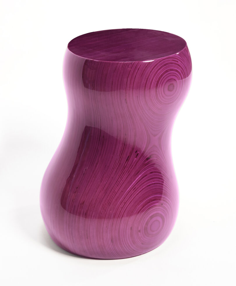 glossy purple curvaceous stacked plywood table