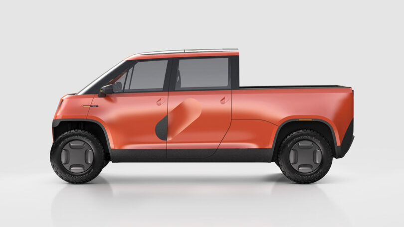 Side view of orange TELO electric truck.