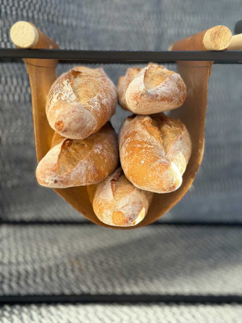 down view of bread baguettes in sling
