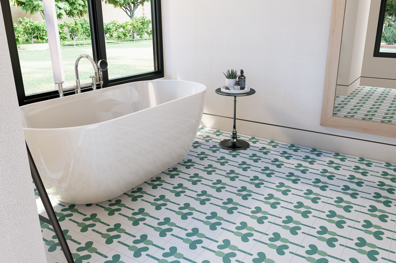 bath with a large tub featuring two-tone green tile flooring