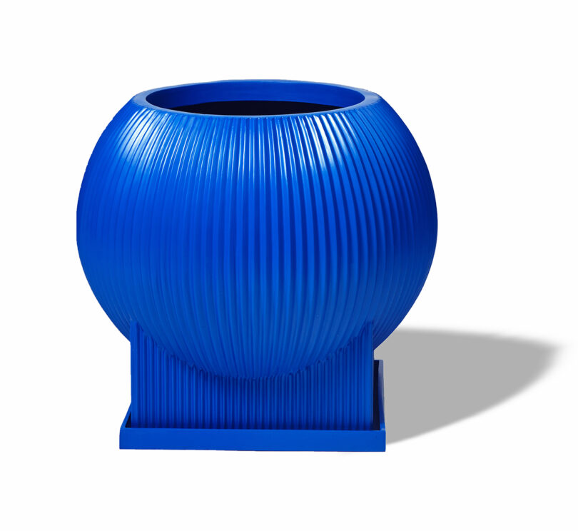 modern cobalt blue fluted urn on white background