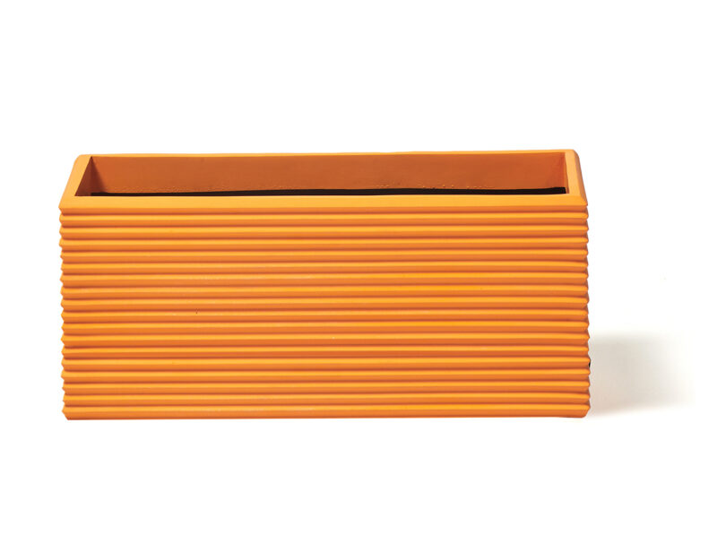 modern wide rectangular fluted orange planter on white background