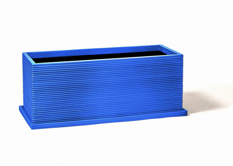 modern wide rectangular fluted cobalt blue planter on white background